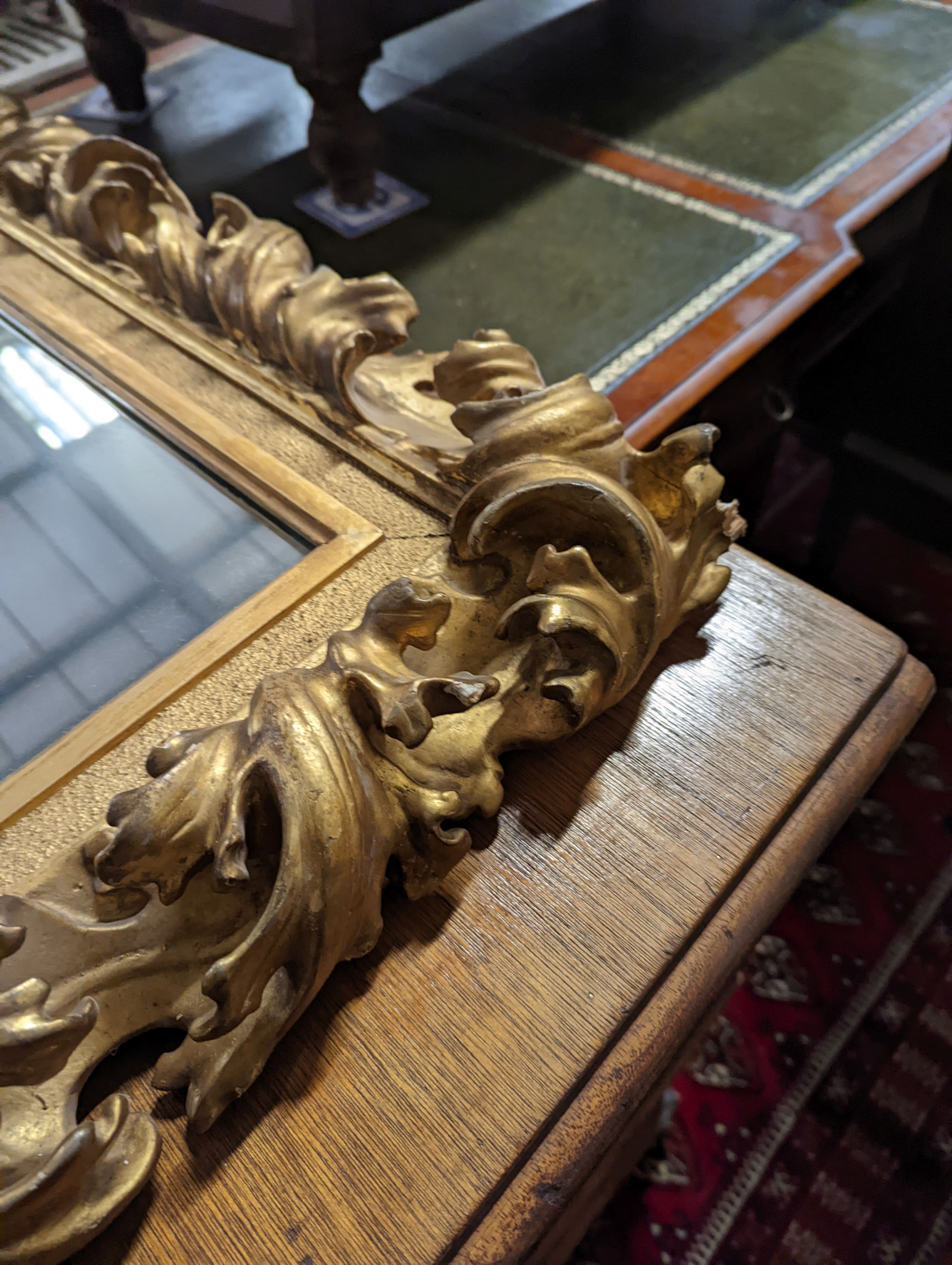 A large 19th century rectangular carved giltwood wall mirror with acanthus scroll frame, width 76cm, height 94cm
